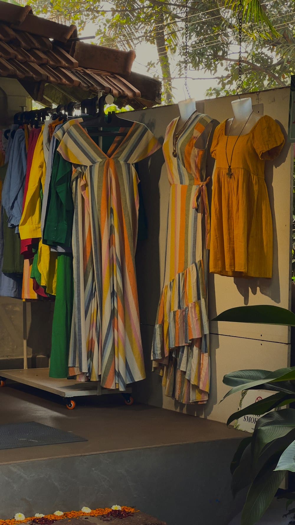 Rows of patterned kurtas hanging in a market boutique
